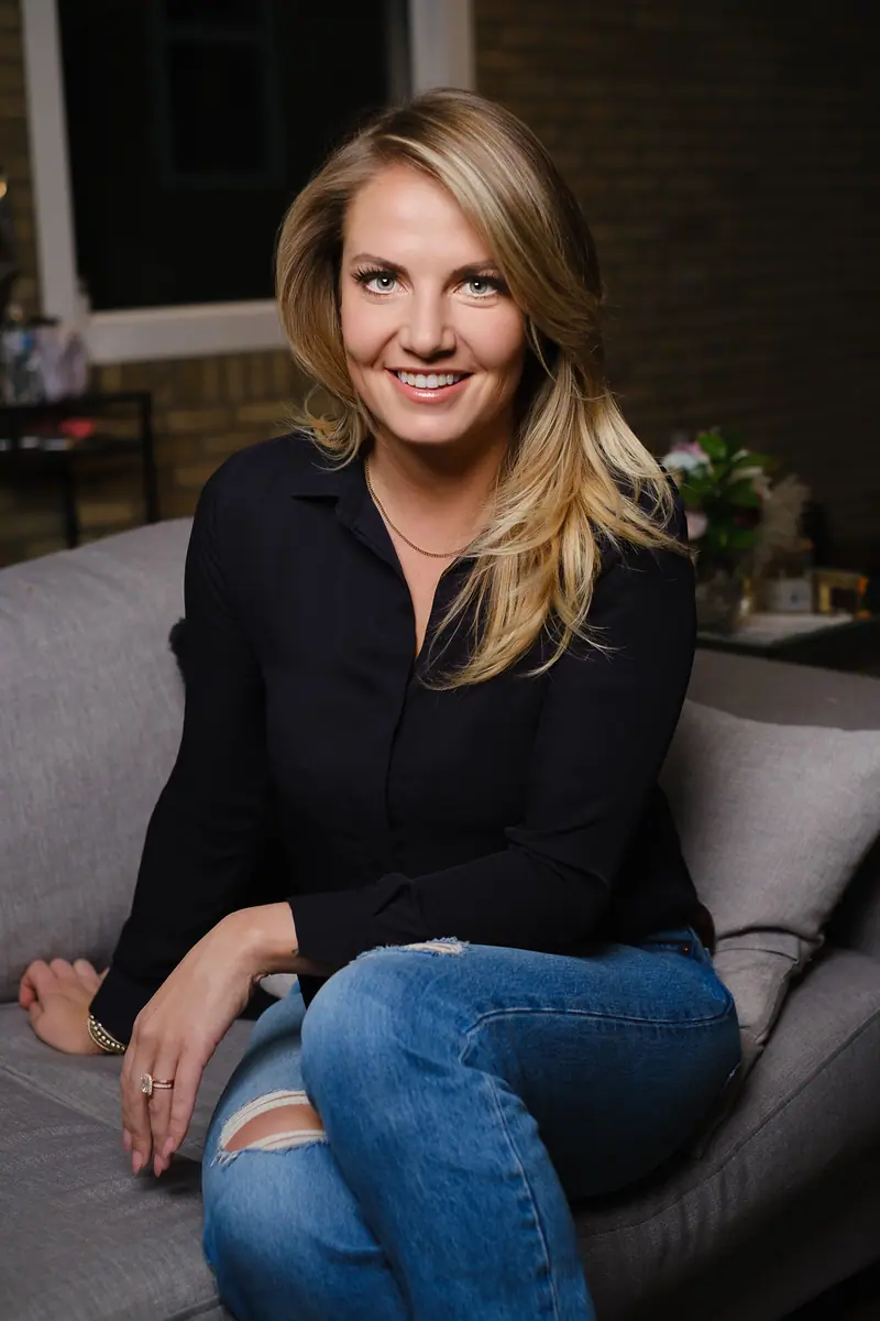 Lifestyle branding portrait of a woman relaxing on a sofa