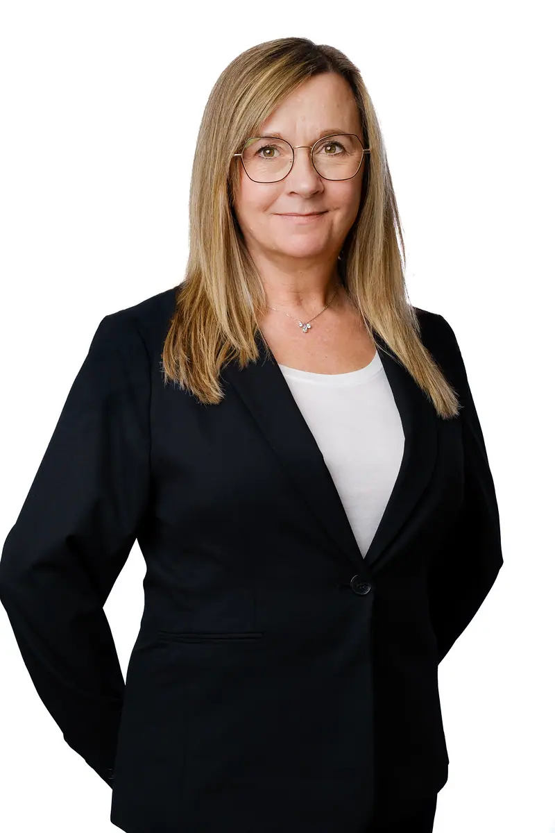 Corporate portrait of a woman in a black blazer on white