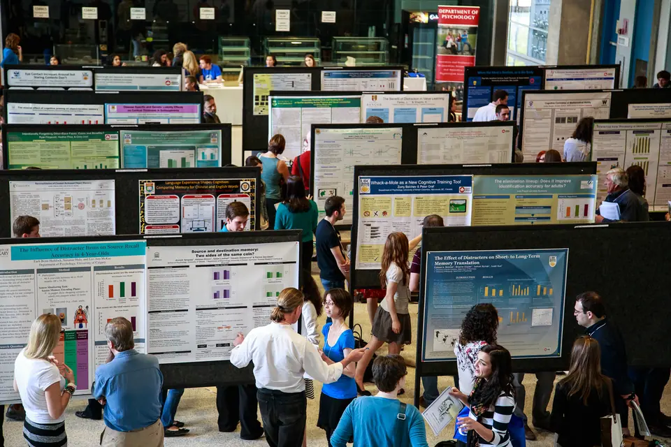 Busy poster session hall at a professional conference