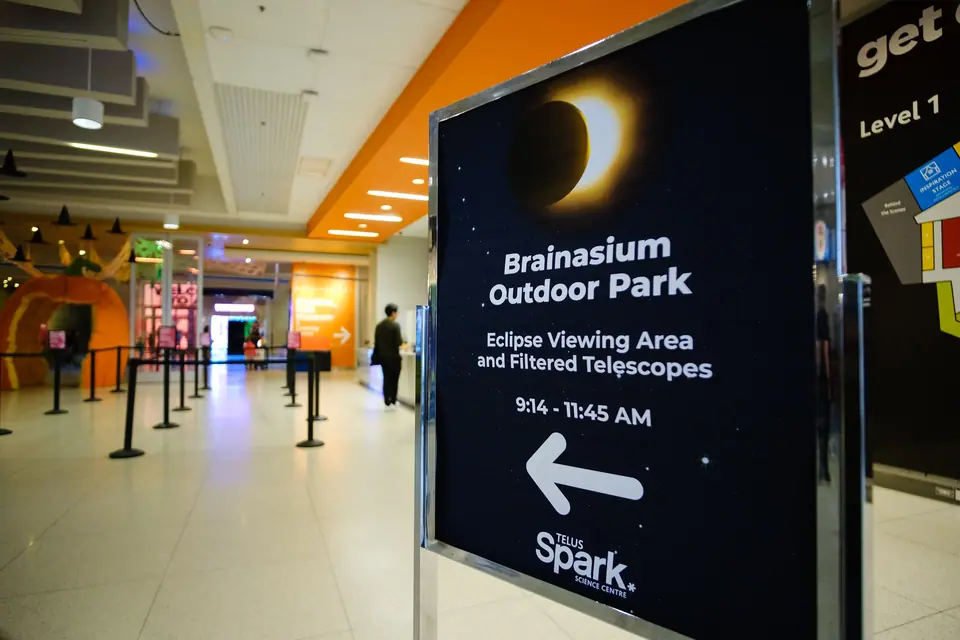 Event signage directing guests to an outdoor eclipse viewing area